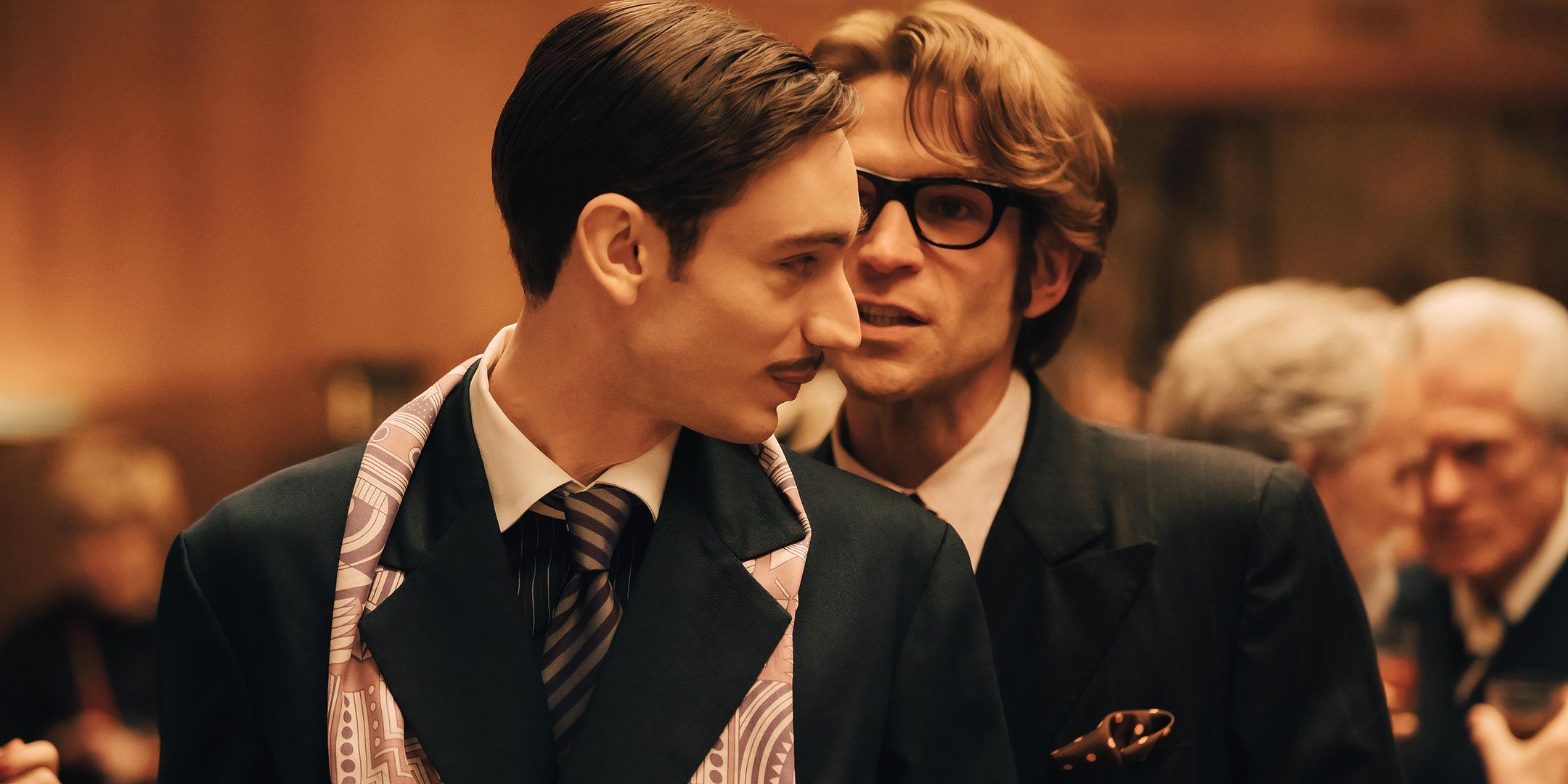 Yves Saint Laurent flirting with Jacques de Bascher in Becoming Karl Lagerfeld