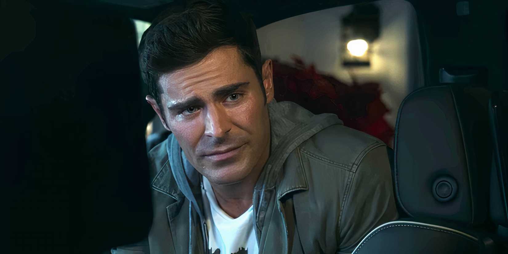 Zac Efron as Chris leaning out of a car in A Family Affair