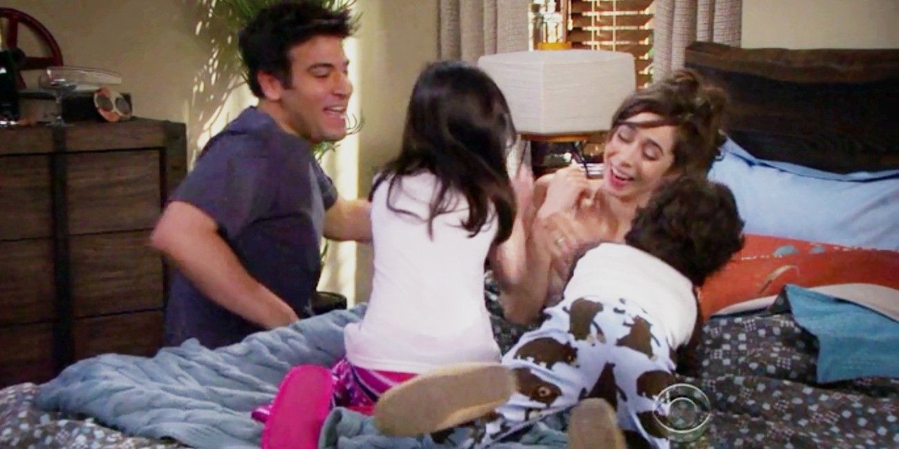 Ted and Tracy playing with their kids in bed in How I Met Your Mother