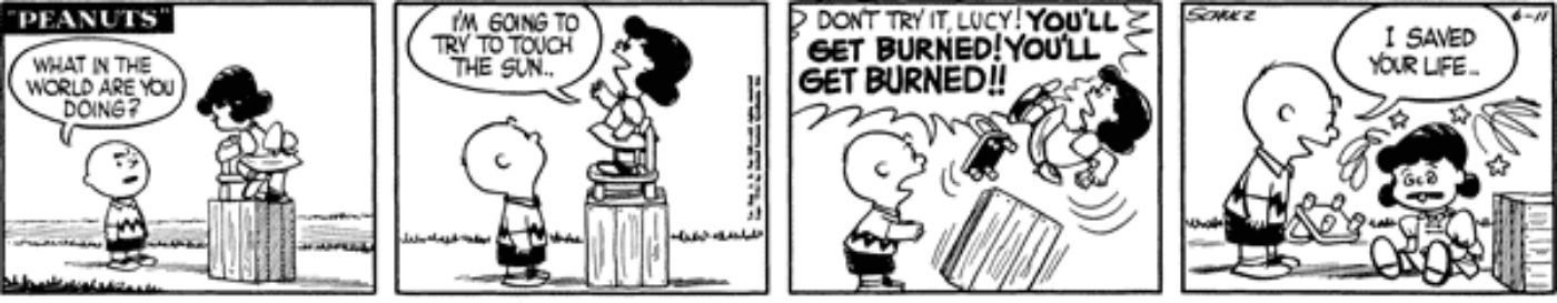 Charlie Brown 'saving' Lucy from getting burned by the sun.