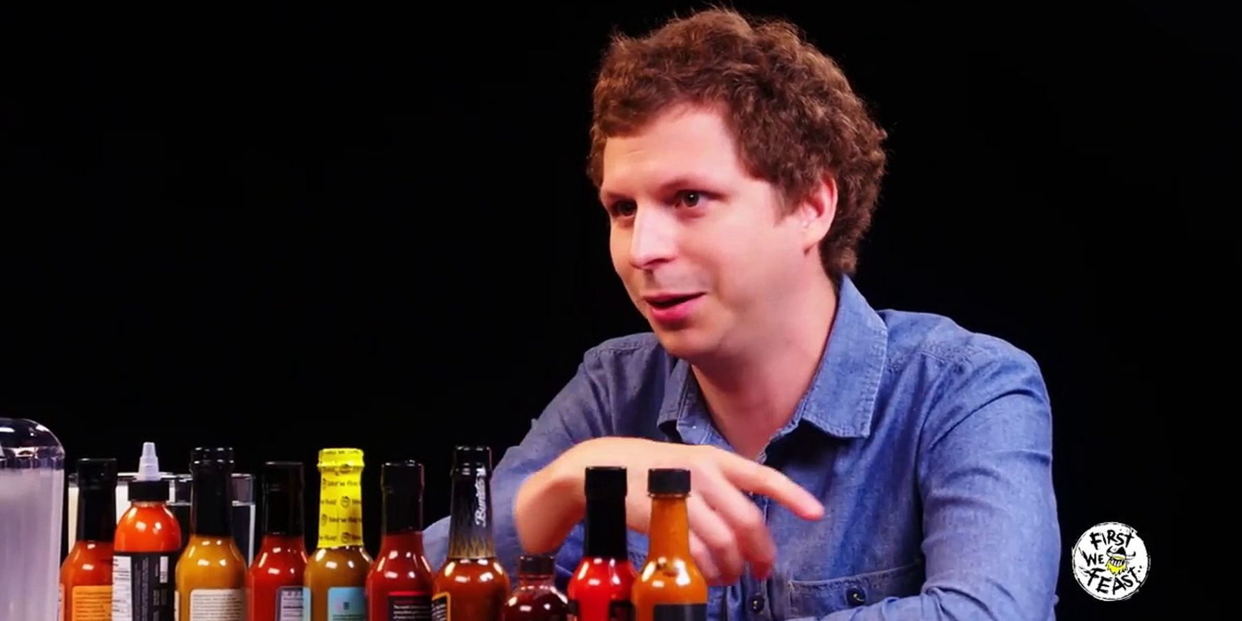 Michael Cera talking to Sean Evans in Hot Ones