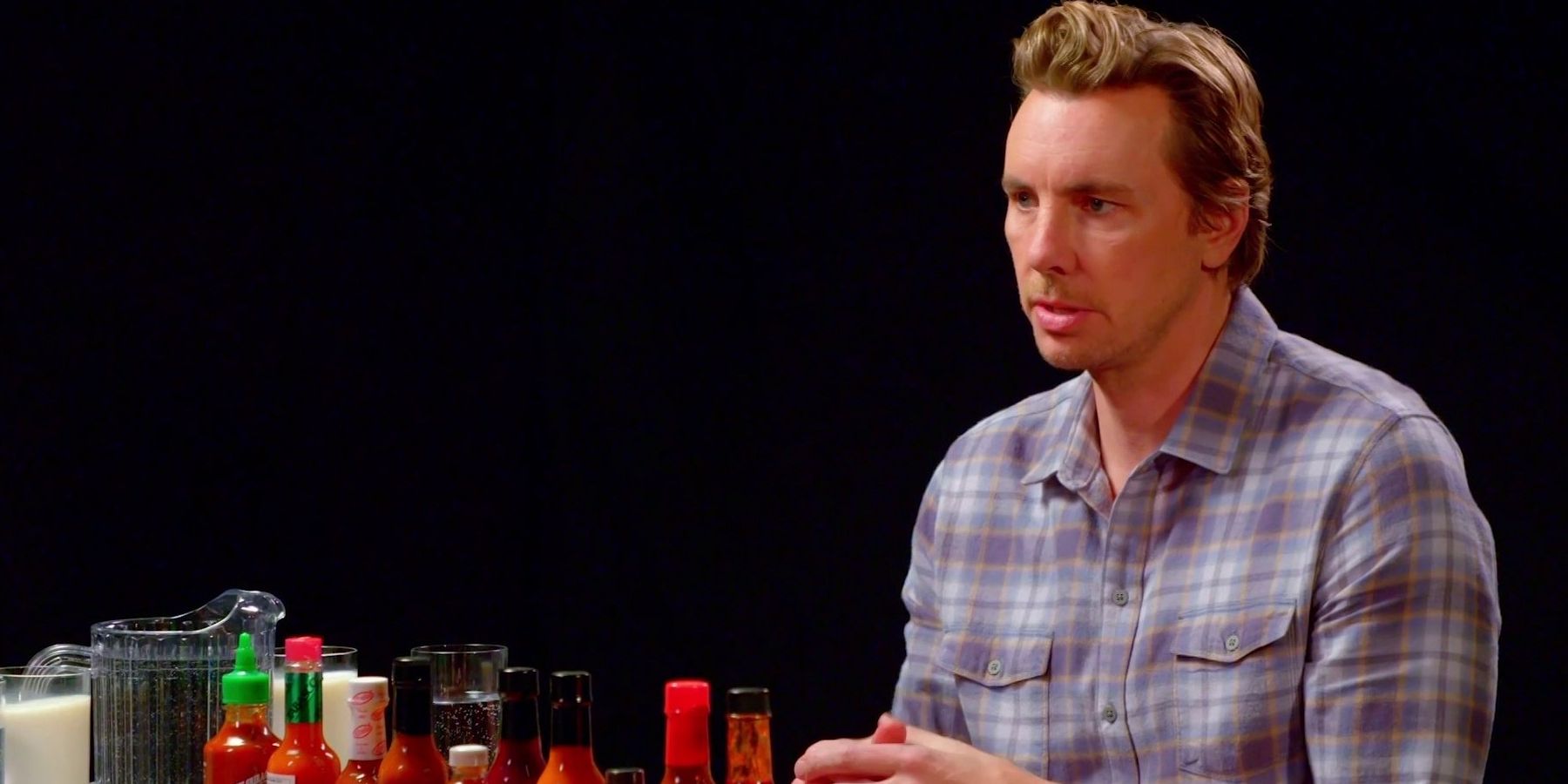 Dax Shepard looking focused in Hot Ones