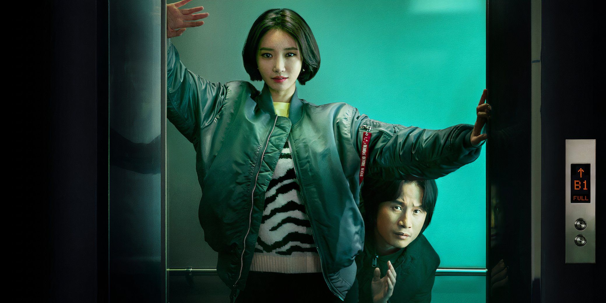 A detective crouches to hide behind a young woman in an elevator doorway in the k-drama Possessed