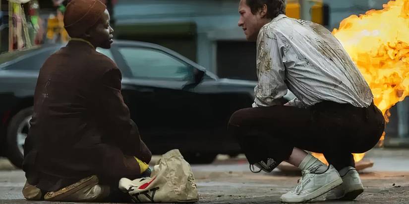 Sam and Eric resting in the street in A Quiet Place Day One