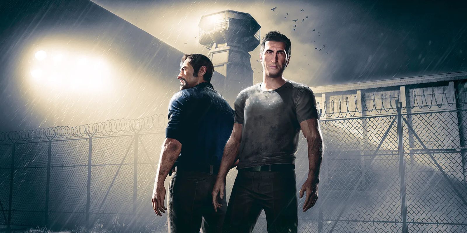 Os dois protagonistas de A Way Out, em frente ao muro e à torre de uma prisão.