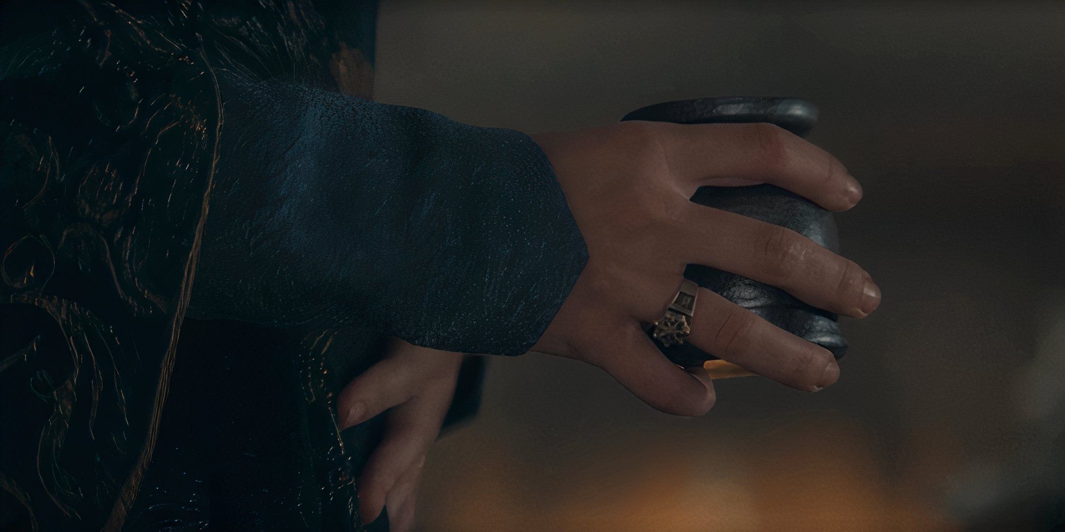 Alicent (Olivia Cooke) holding a drink with a hand on her stomach in House of the Dragon season 2, episode 4