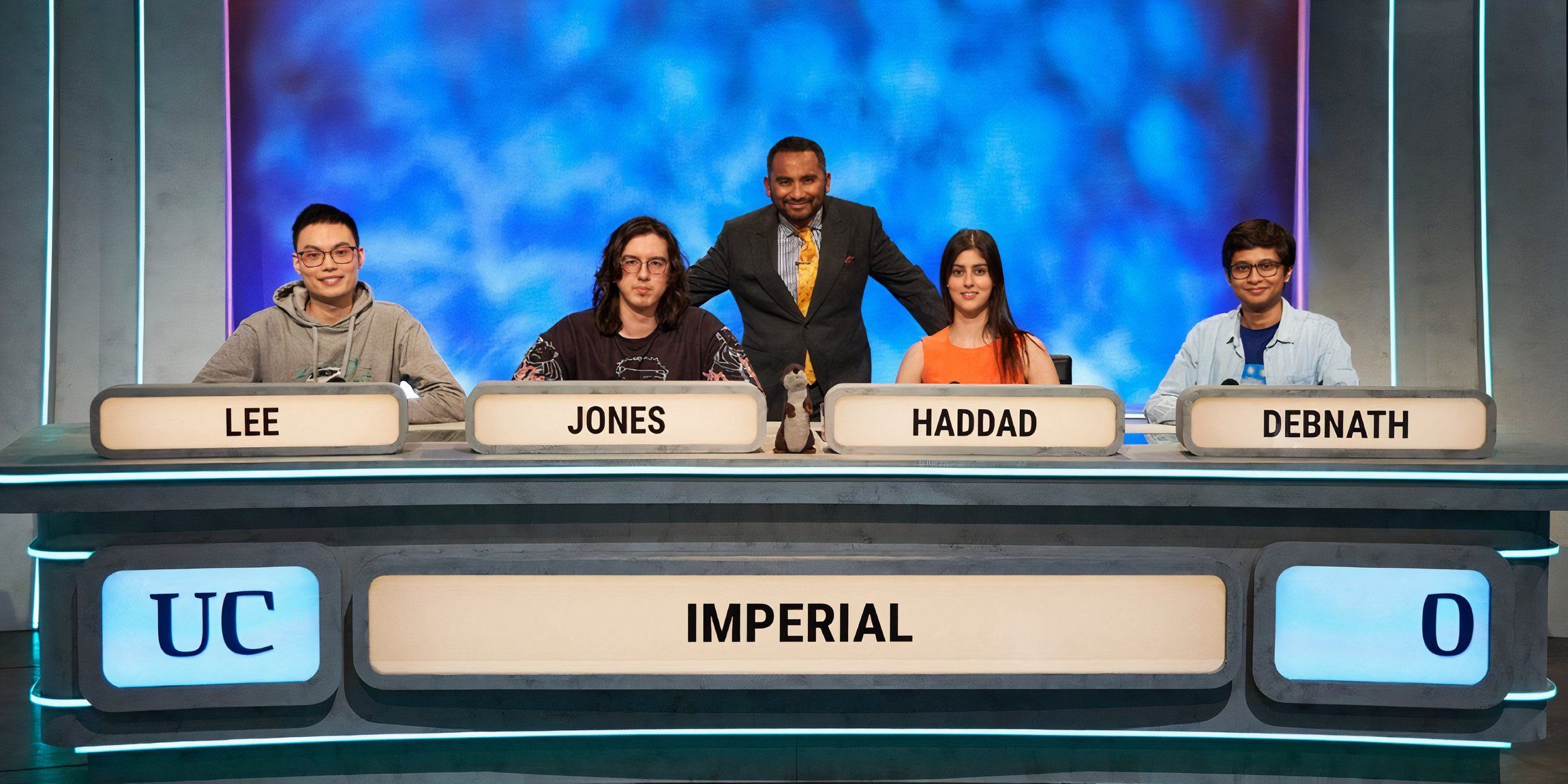 Amol Rajan standing with contestants from Imperial College London on the set of University Challenge