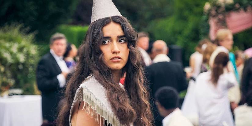 Asha Banks as Cara Ward in A Good Girl's Guide to Murder wearing a party hat