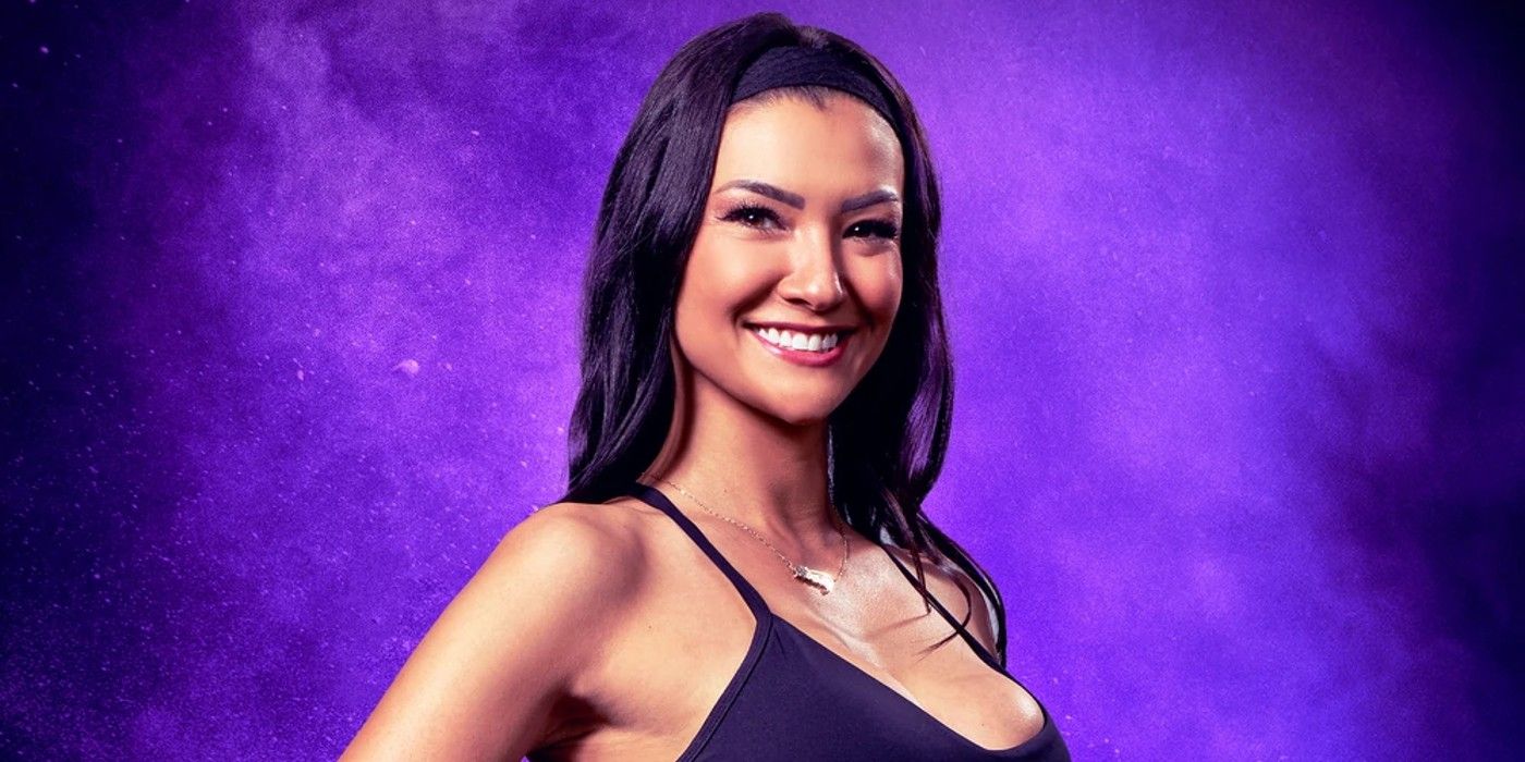 Averey Tressler from The Challenge Season 40 smiling with her hand on her hip in front of a purple background.