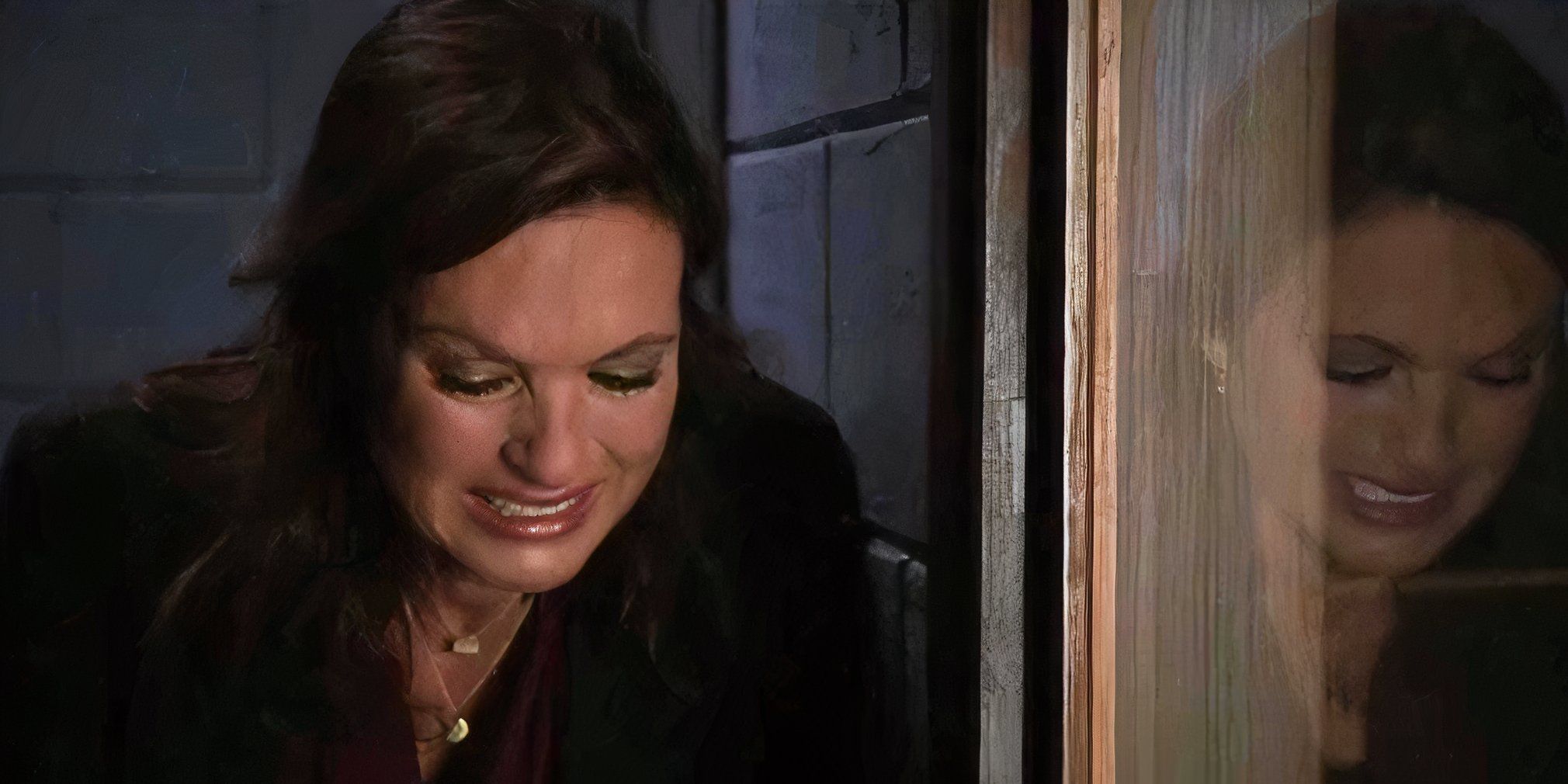 Benson crying by an interrogation room window in the SVU episode Scorched Earth