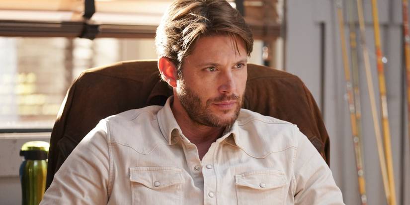 Big Sky Jensen Ackles as Beau looking forward and sitting in a desk chair 