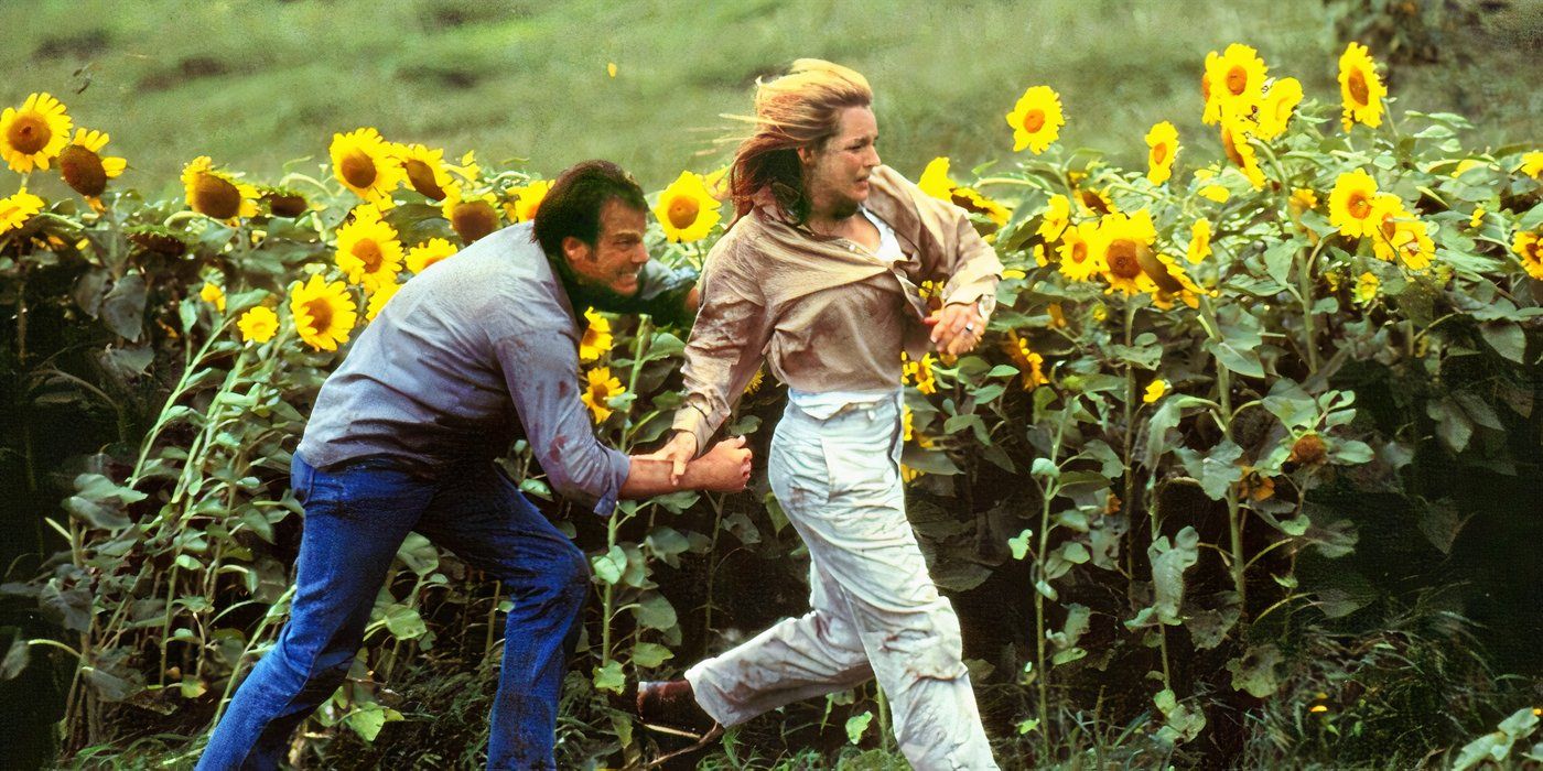 Bill Paxton y Helen Hunt caminan por los campos de girasoles en Twister