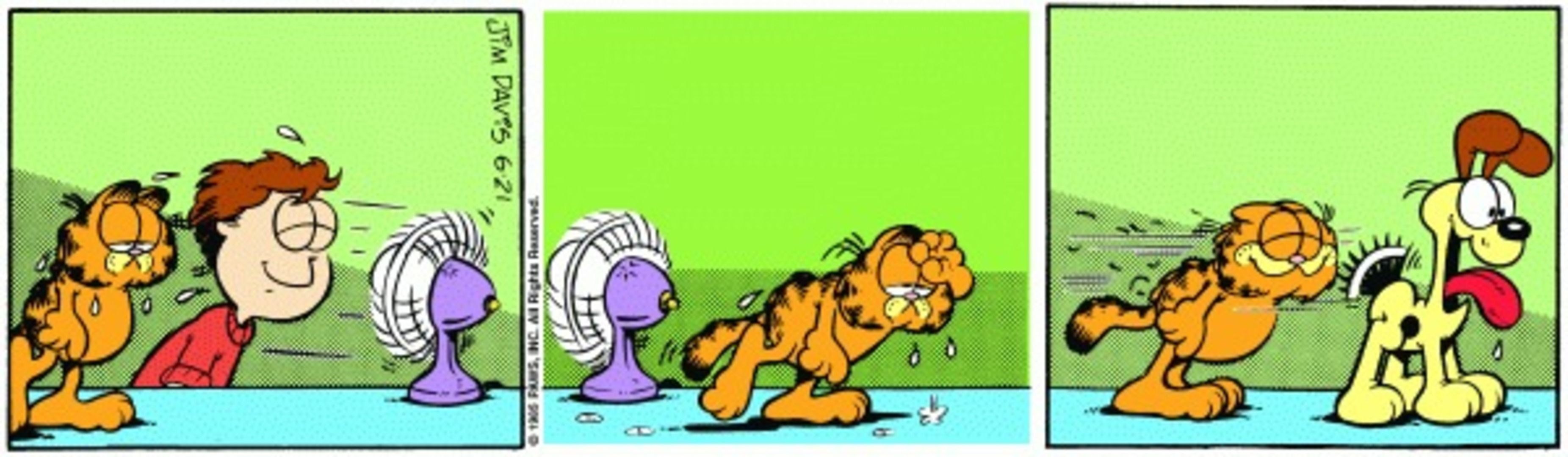 Garfield using Odie&rsquo;s wagging tail as a fan.
