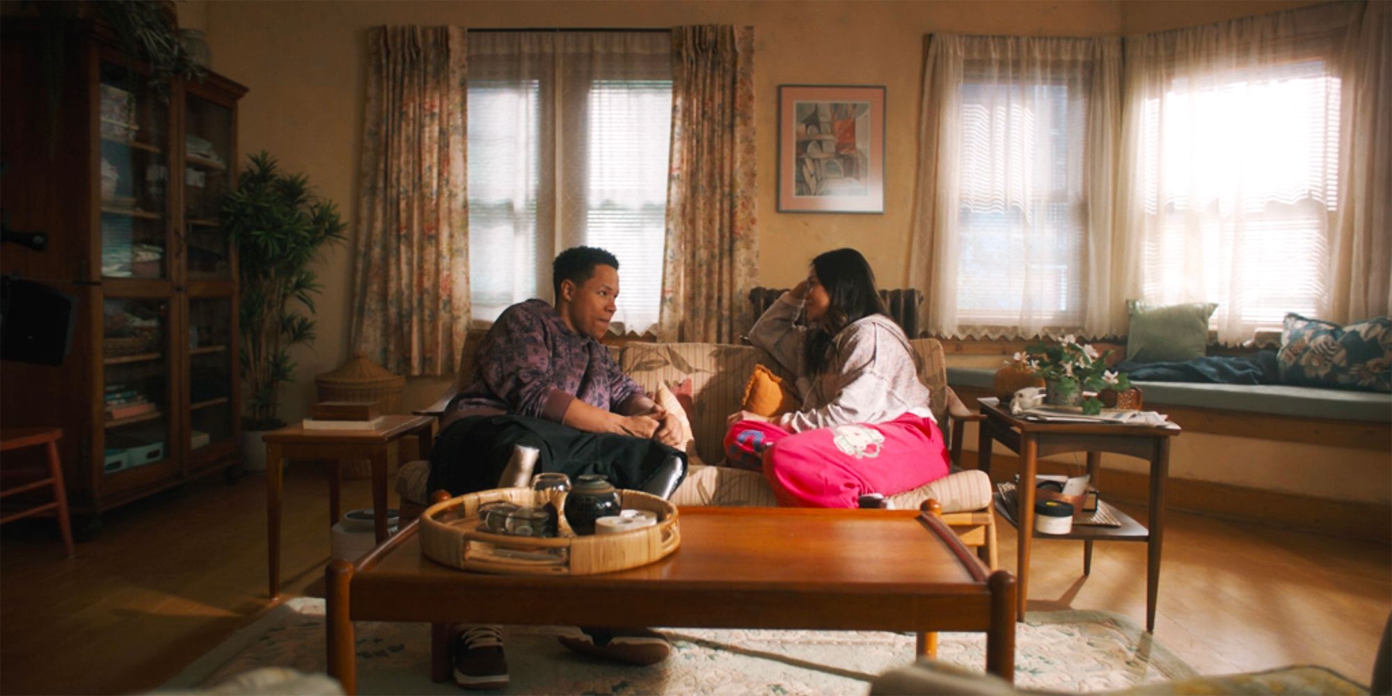 Bobby and Sun Mai on the couch in Tracker