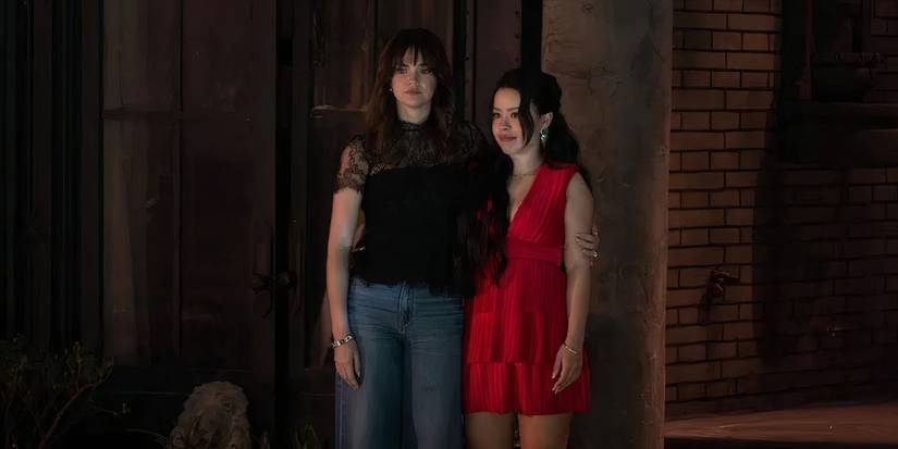 Callie (Maia Mitchell) holding Mariana (Cierra Ramirez) in the Good Trouble series finale.