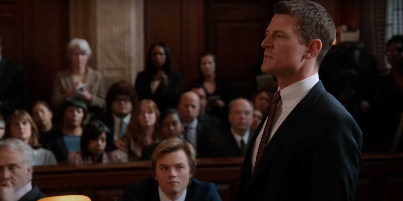 Chicago Justice Philip Winchester as SSA Peter Stone standing sideways as he tries a case