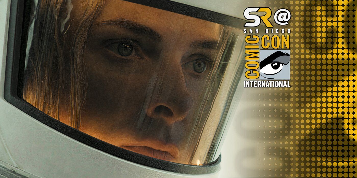Close up of Juliette in her clean up suit, a white helmet with a glowing yellow light inside in silo with SDCC overlay