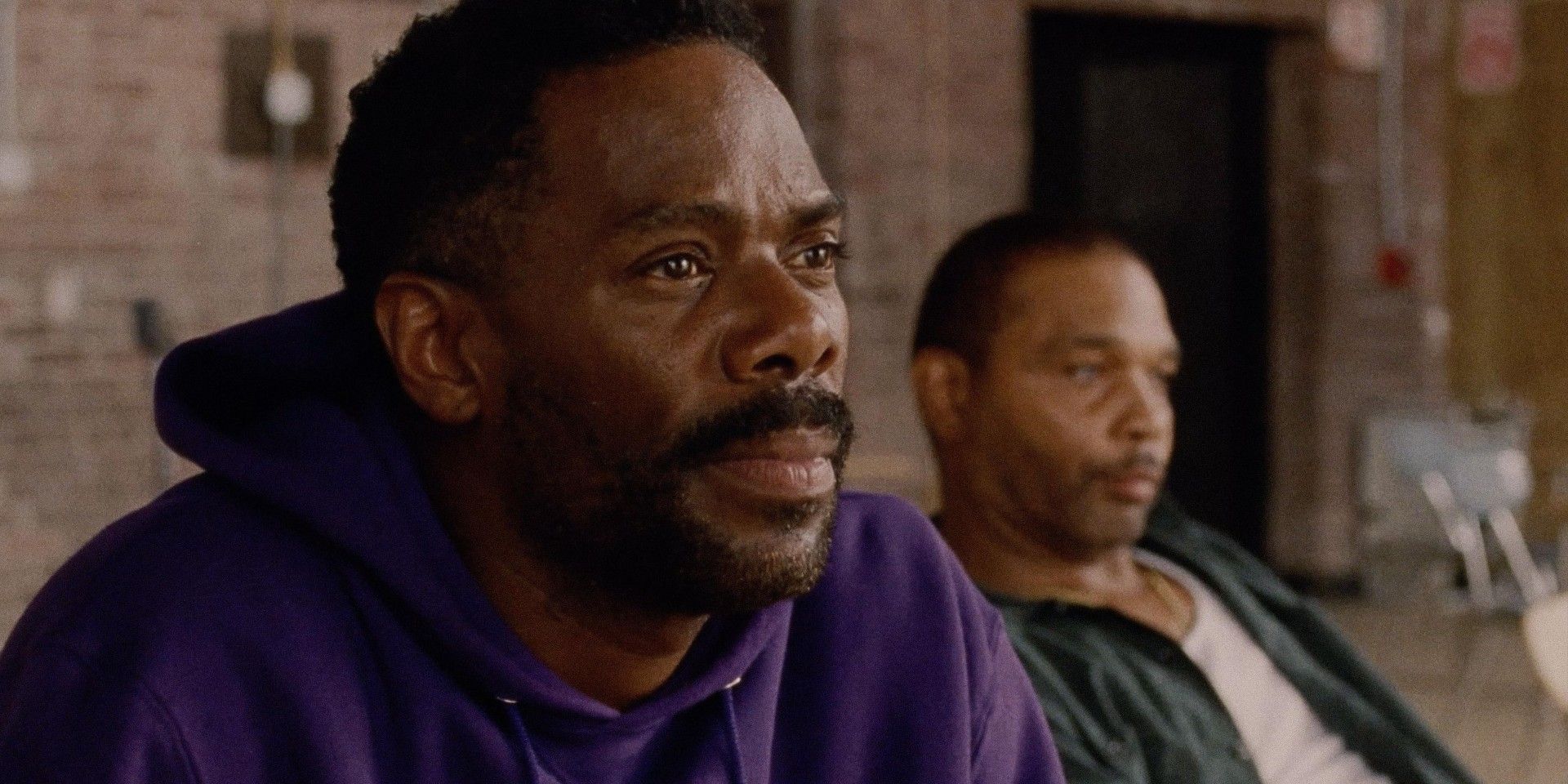 Colman Domingo leaning forward in his seat while Clarence Maclin lounges in the background in Sing Sing