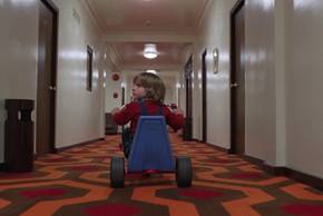 Danny riding his tricycle through the hotel in The Shining.