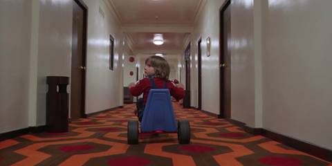 Danny riding his tricycle through the hotel in The Shining.