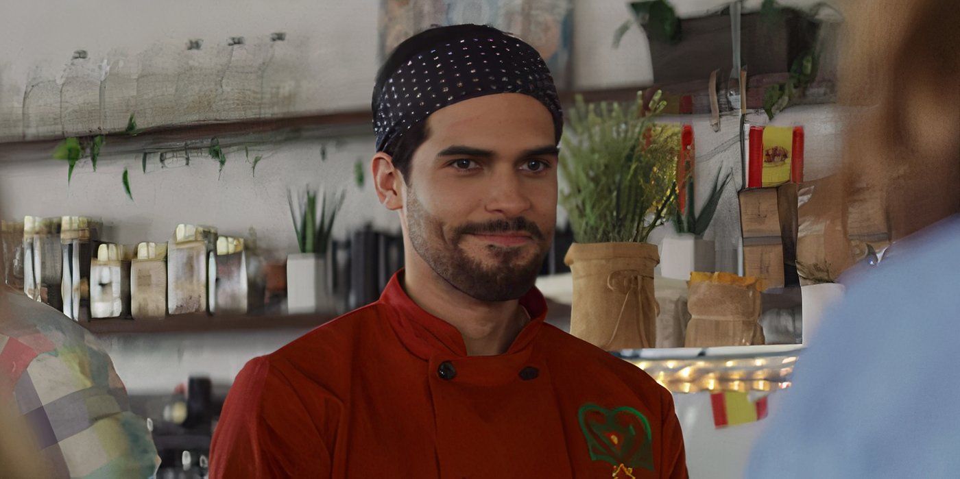 Isaac Gonzalez Rossi smiles while wearing a headband in a restaurant 