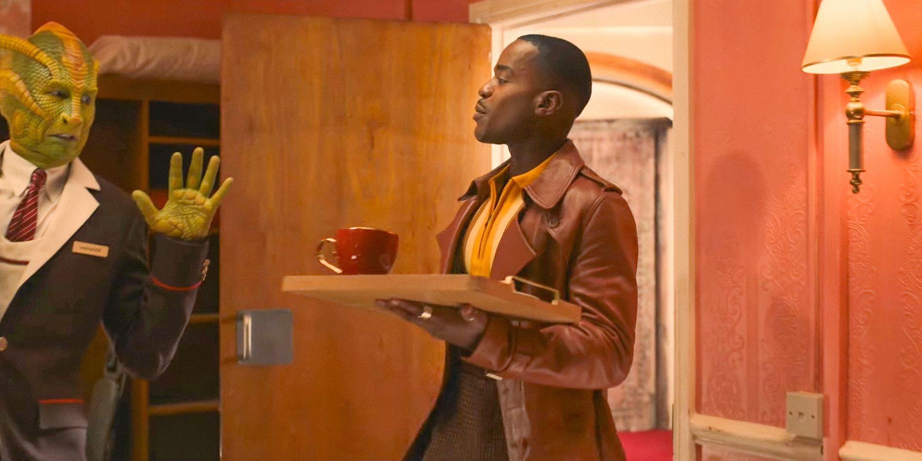 The Doctor (Ncuti Gatwa) makes his appearance in Joy's hotel room, offering a ham and cheese toastie and a pumpkin latte in Doctor Who Christmas Special Clip (2024)