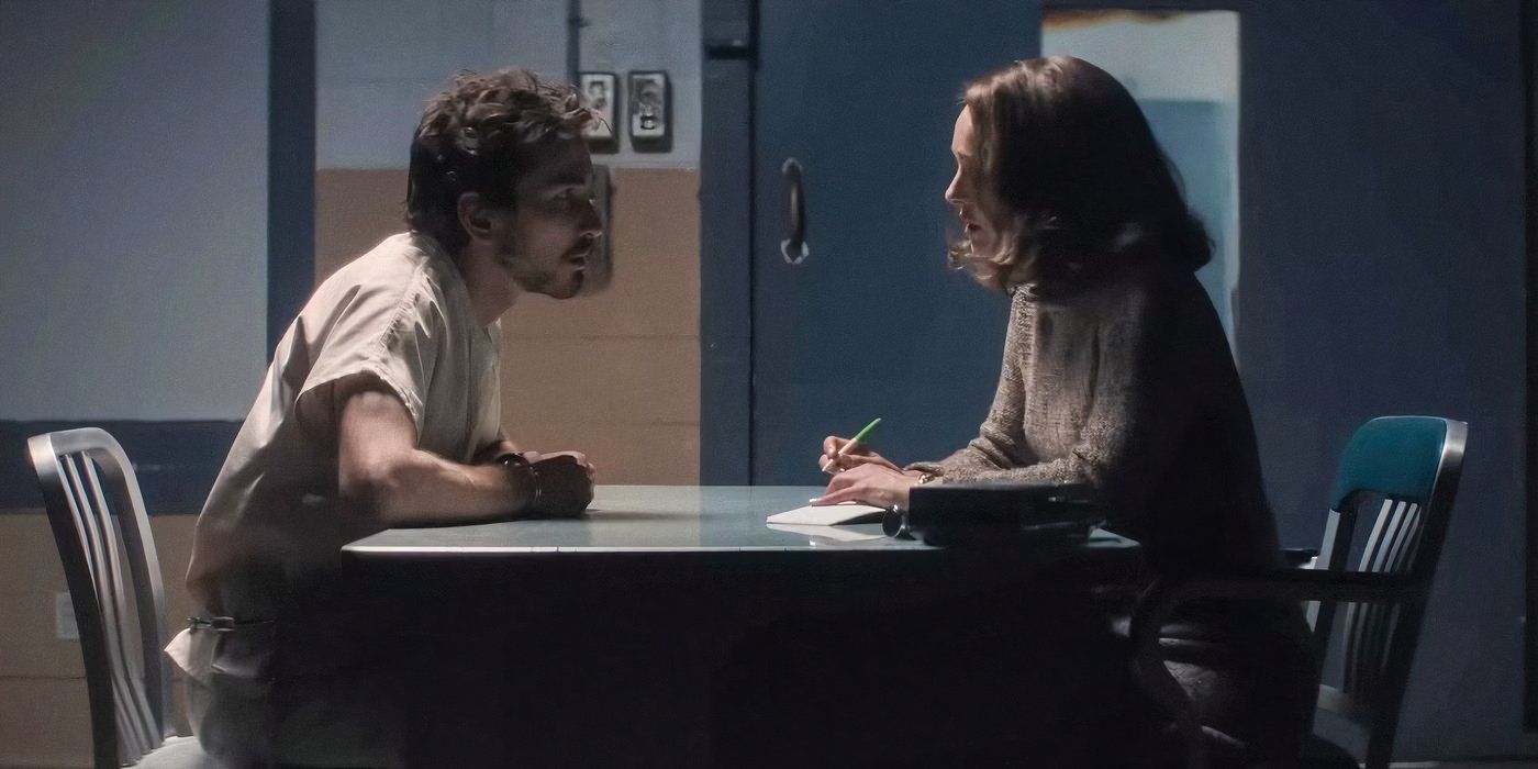 Dylan Arnold as Stephen Zawadzkie and Natalie Portman as Maddie Morgenstern speaking in a prison conference room in Lady in the Lake