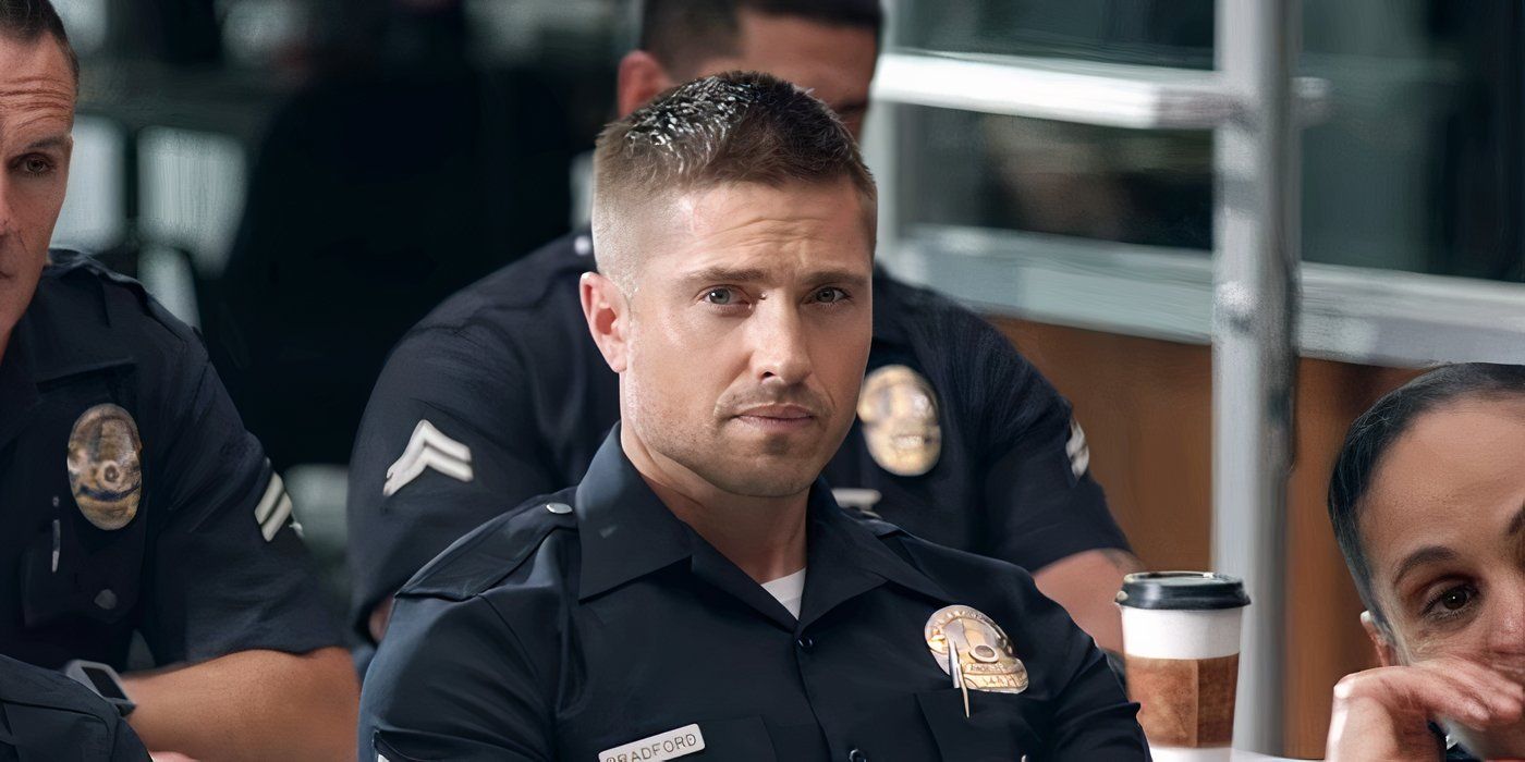 Tim Bradford staring ahead while seated with other cops in The Rookie