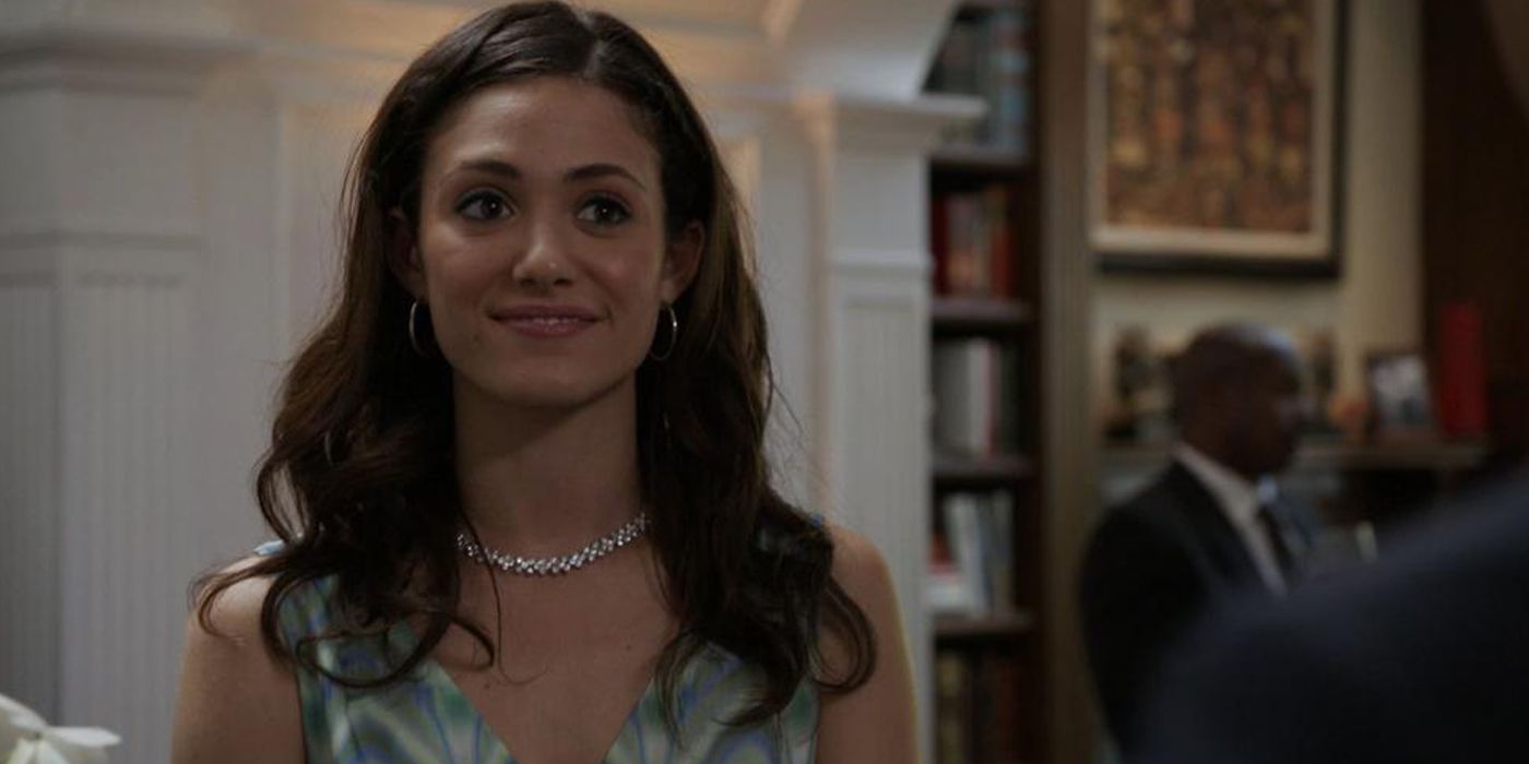 Fiona smiling in a restaurant in Shameless.