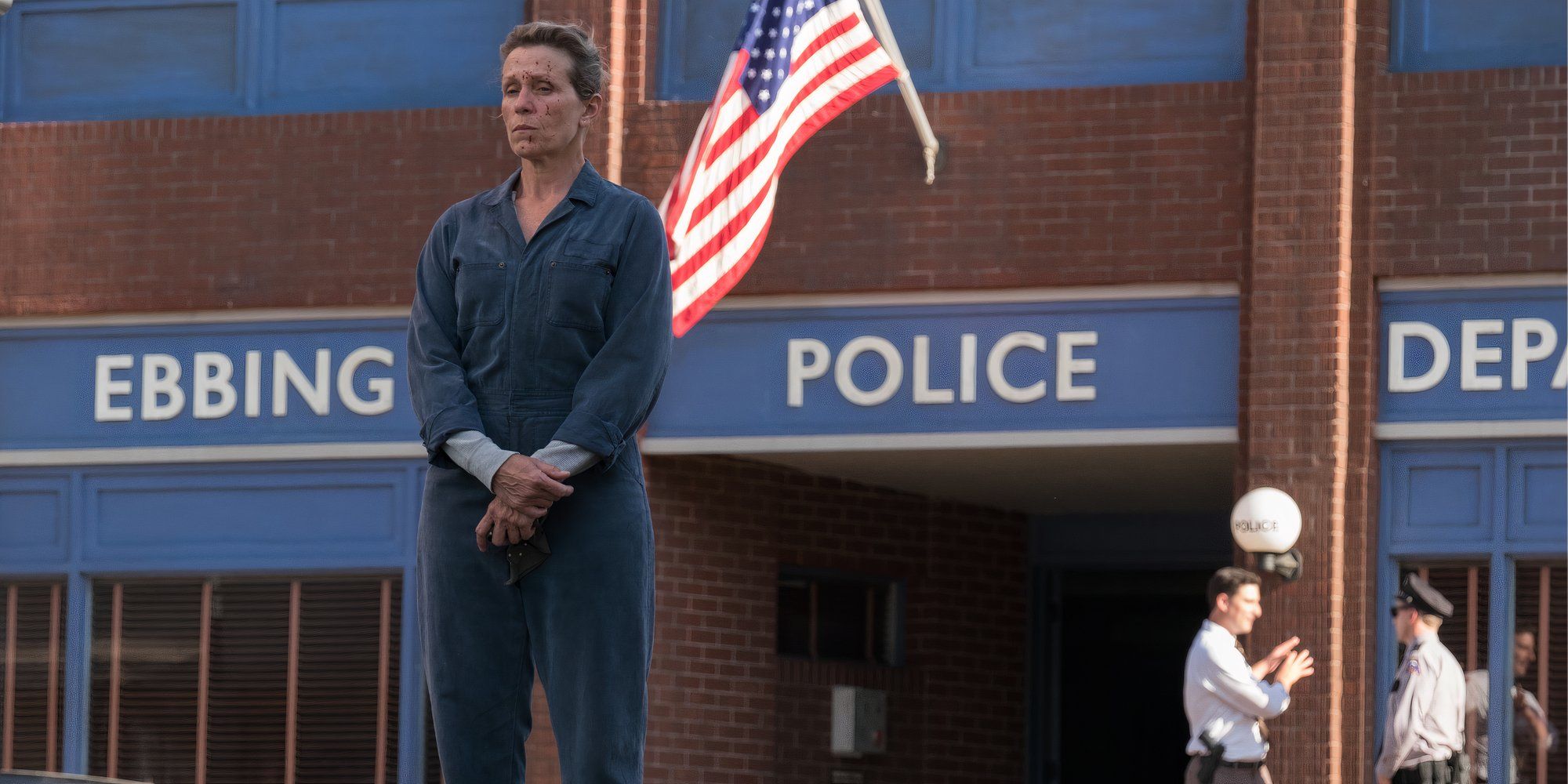 Frances McDormand in Three Billboards standing outside police department