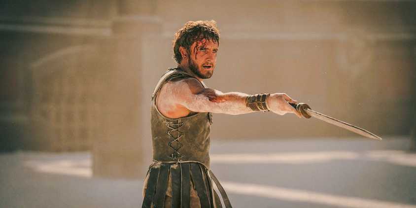 Lucius Verus (Paul Mescal) holds out his sword as in Gladiator 2