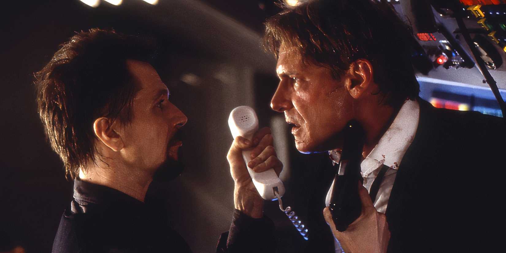 Harrison Ford and Gary Oldman in Air Force One with gun to Harrison Ford's throat