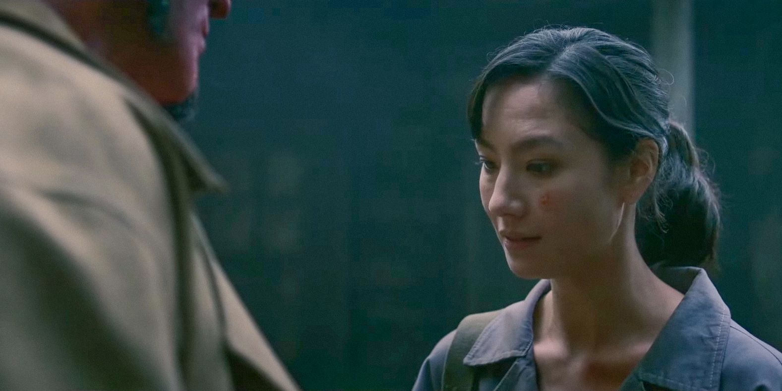 Bobbie Jo Song (Adeline Rudolph) looks nervous in front of Hellboy in Hellboy: Crooked Man