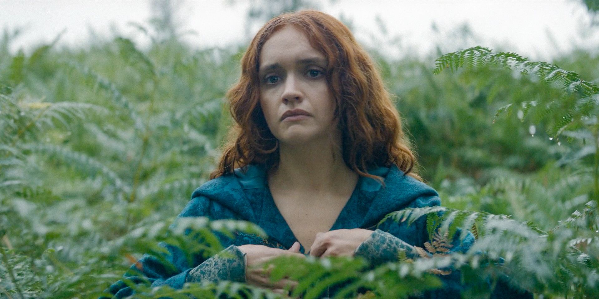 Alicent (Olivia Cooke) expresionless, walking through the dense vegetation in House of the Dragon Season 2 Episode 7