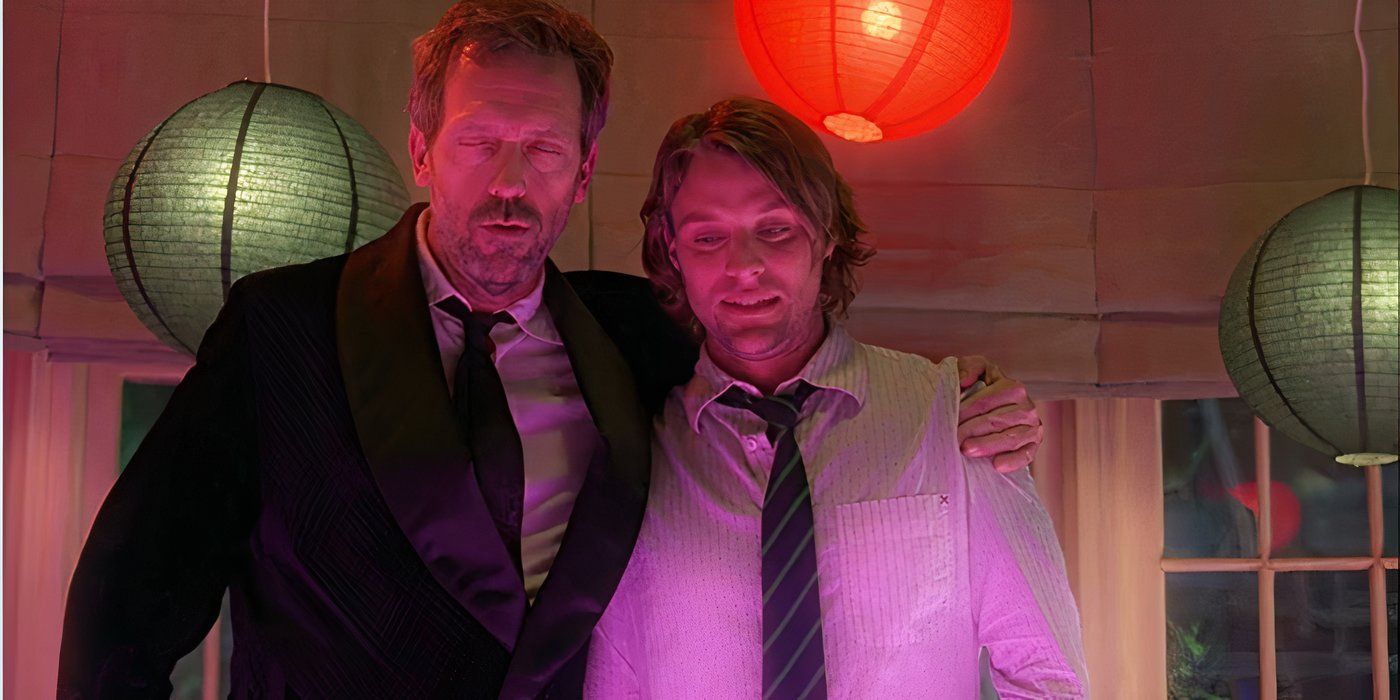 House (Hugh Laurie) with his arm around Chase (Jesse Spencer) with red lighting in House MD