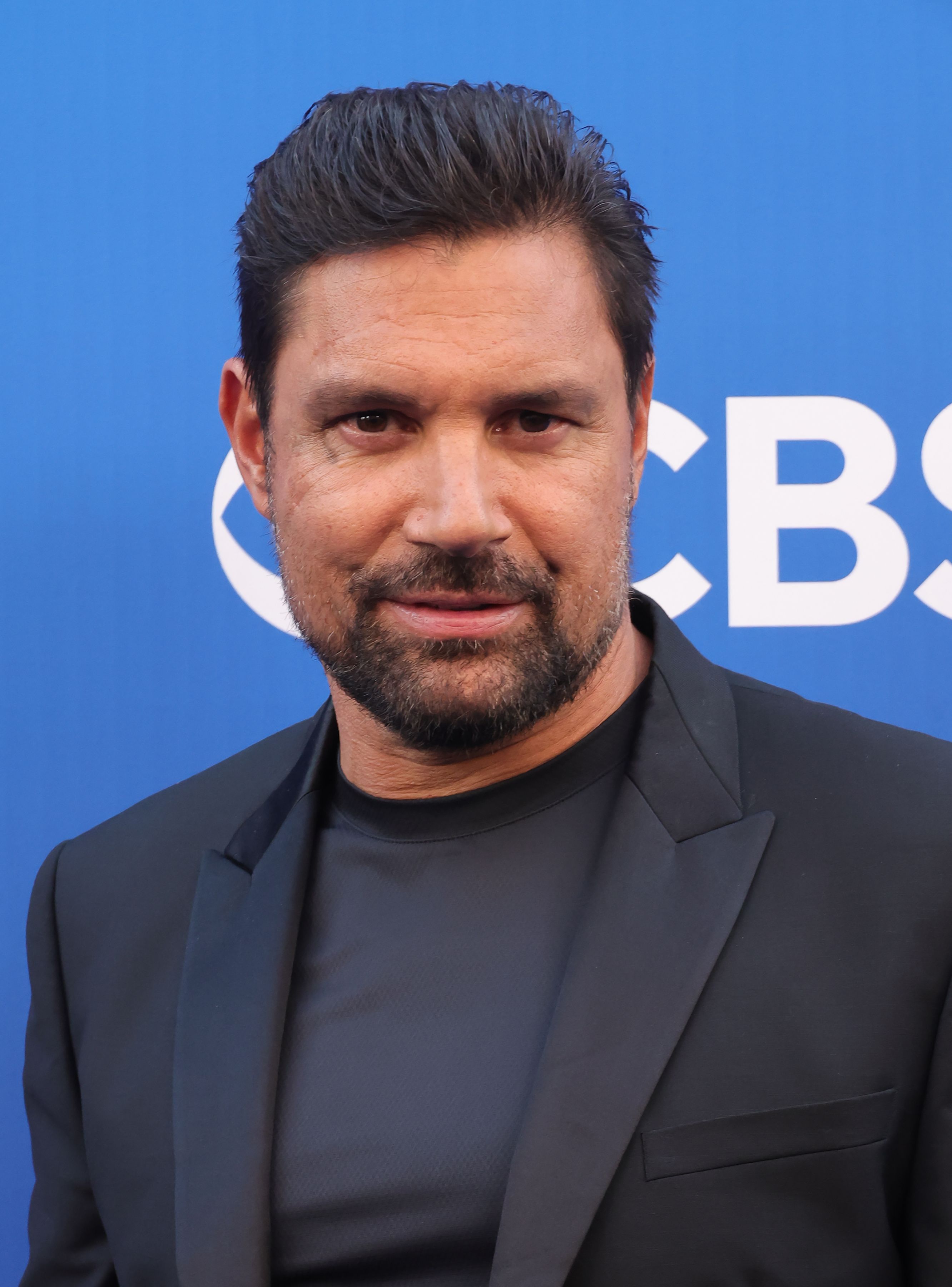Headshot Of Manu Bennett