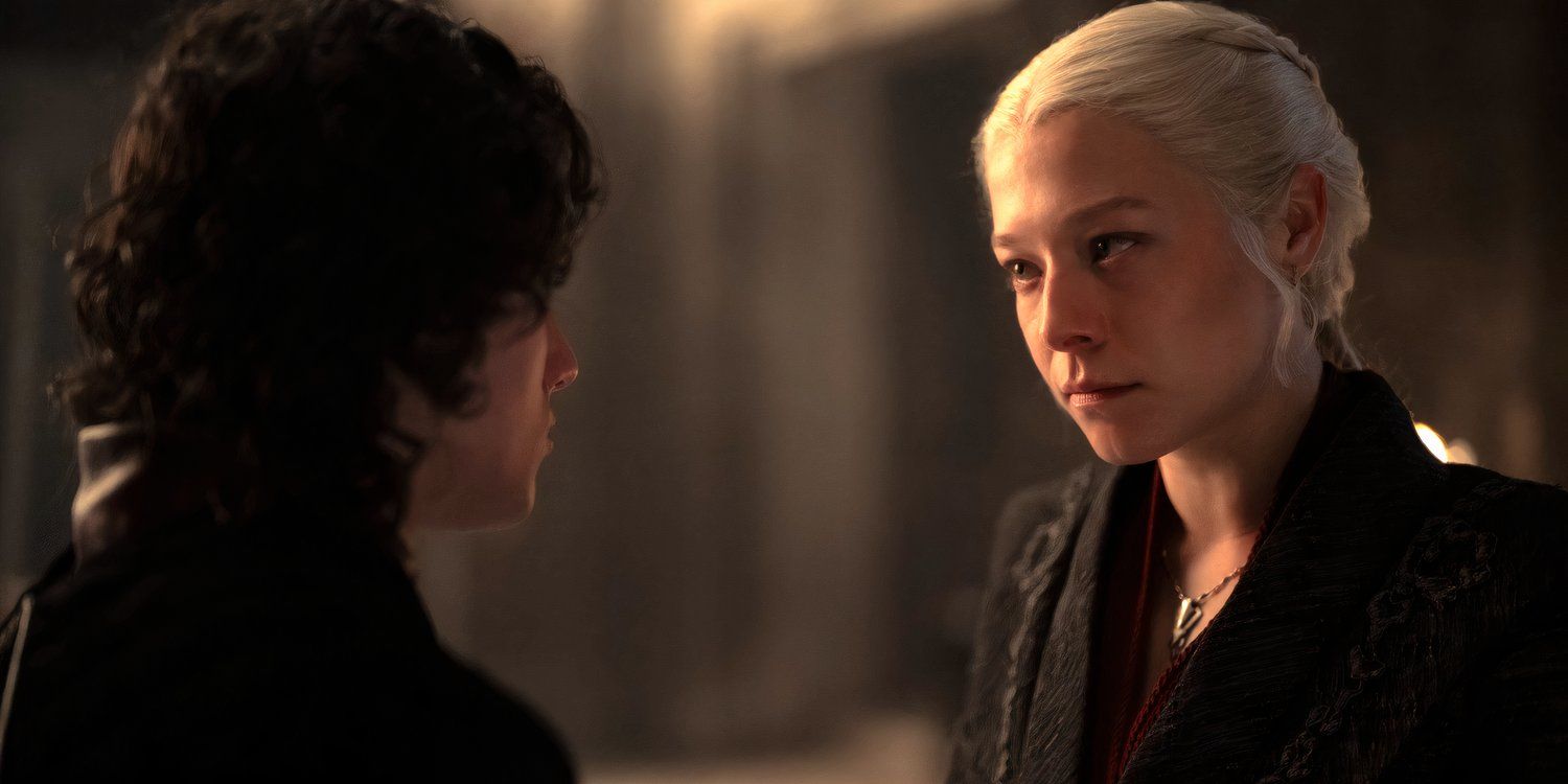 A woman with blonde hair (Rhaenyra) looks sternly at a boy with curly black hair (Jacaerys). We can only see from their chests up.