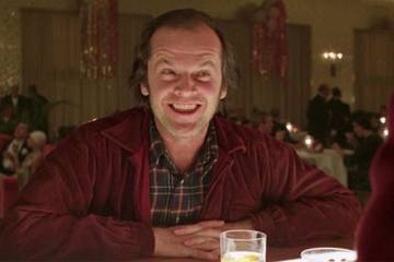 Jack smiling as he gets a drink in The Shining