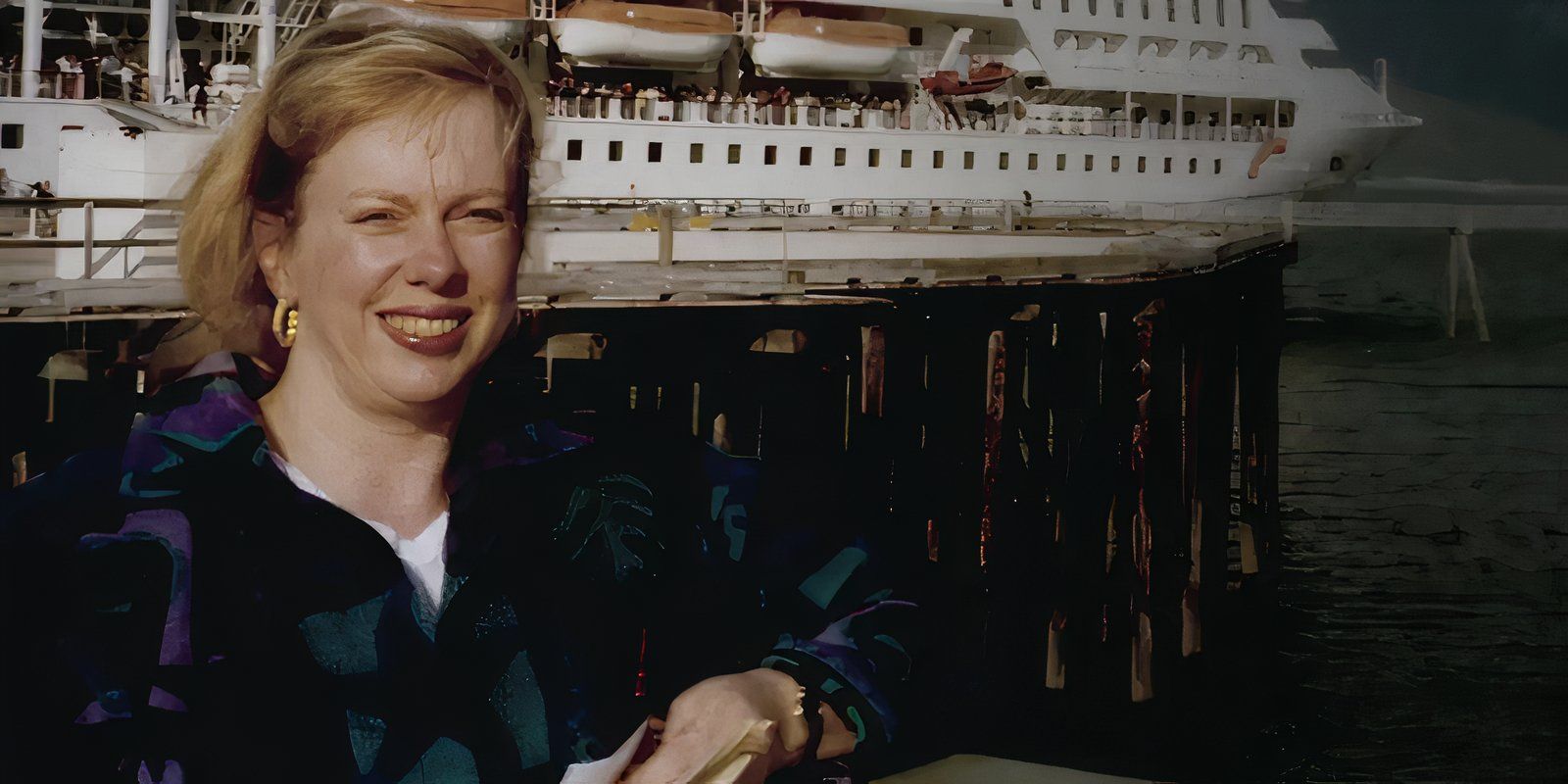 Jana Koklich smiles in front of a ship in Homicide: Los Angeles