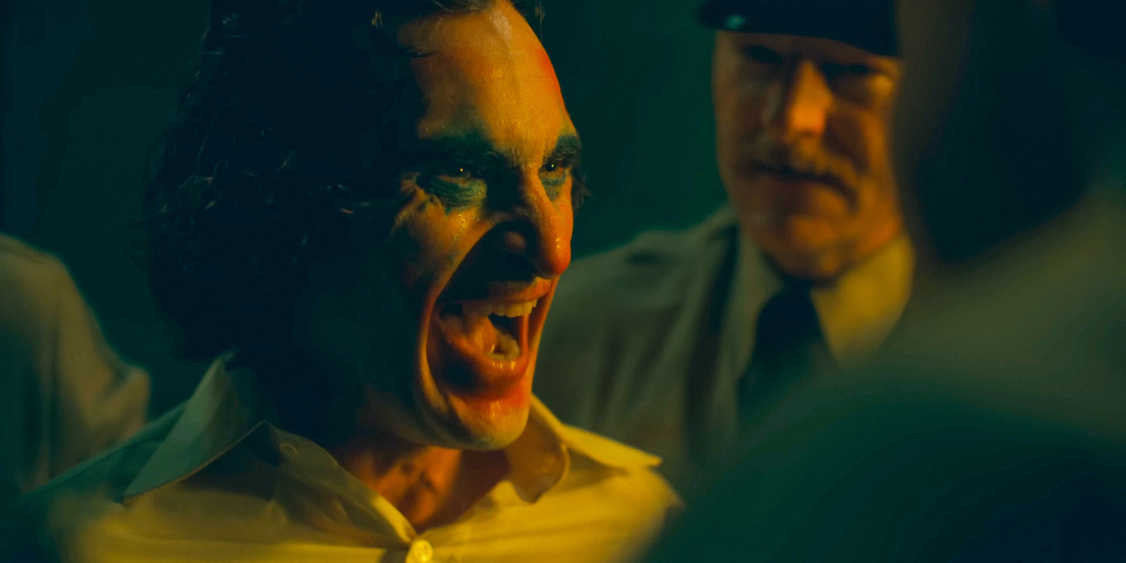 Joker (Joaquin Phoenix) laughing maniacally in Joker: Folie à Deux