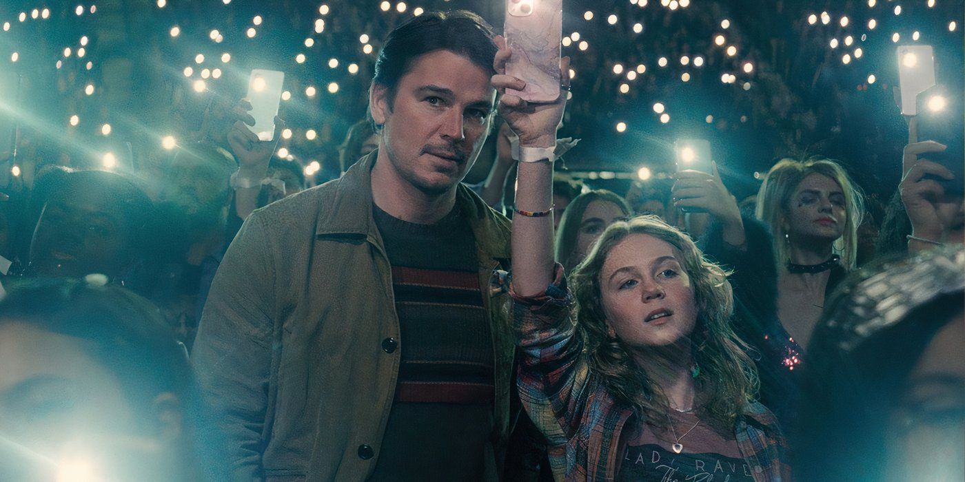 Josh-Hartnett as Cooper aka The Butcher with his daughter holding a her phone at a concert in Trap