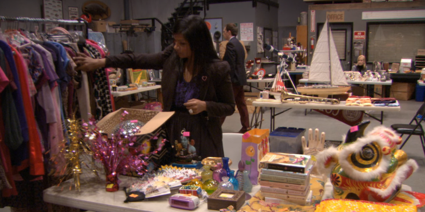 Kelly and her stuff to sell in The Office Garage Sale