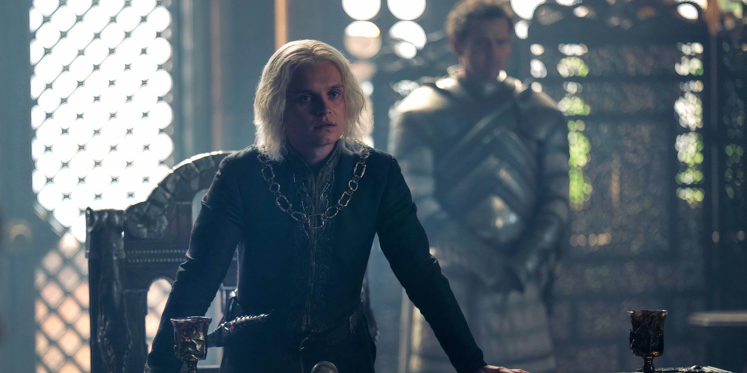 King Aegon (Tom Glynn-Carney) standing up at a table in House of the Dragon season 2, episode 4