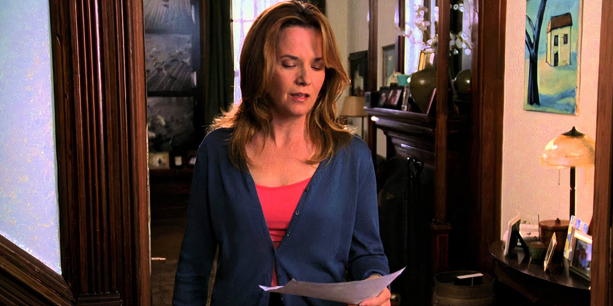 Lea Thompson looking down at a piece of paper in her guest star appearance in the SVU episode Birthright