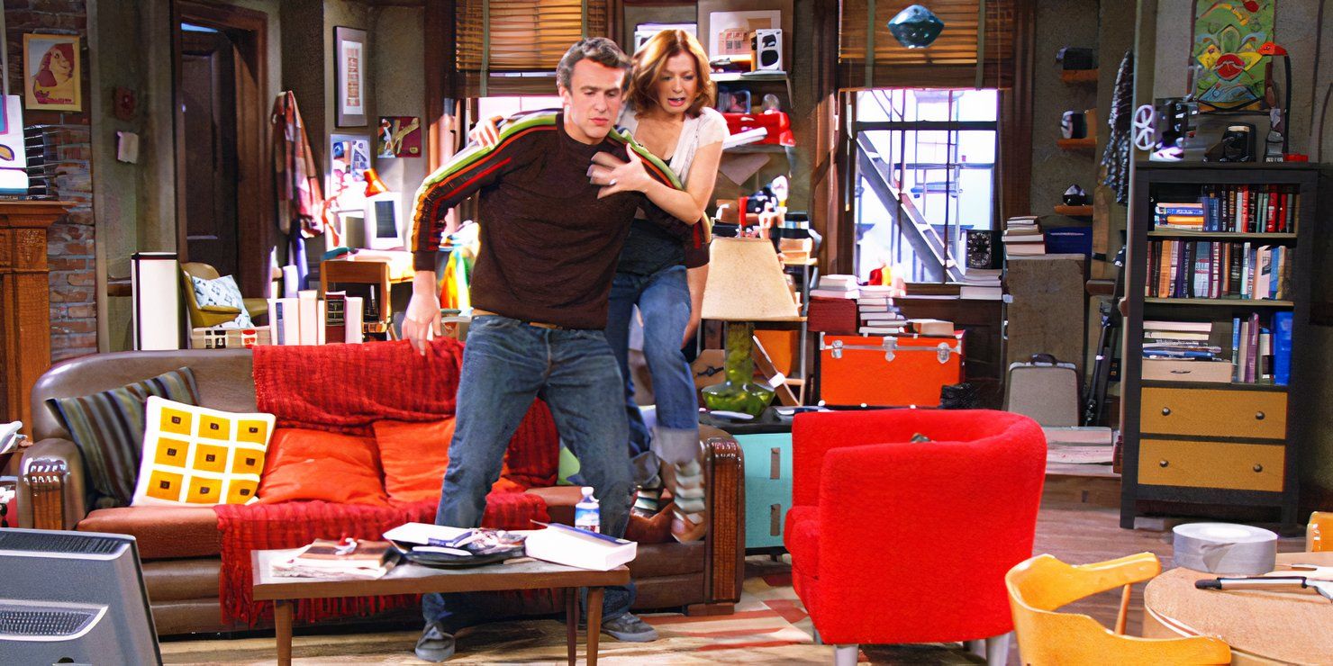 Lily standing on the couch with Marshall in front of her in How I Met Your Mother