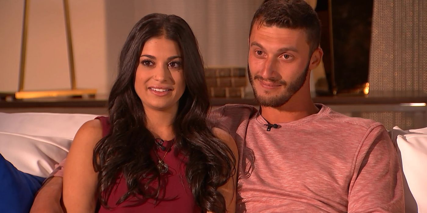 Loren and Alexei Brovarnik in 90 Day Fiance sit smiling next to each other for Tell All