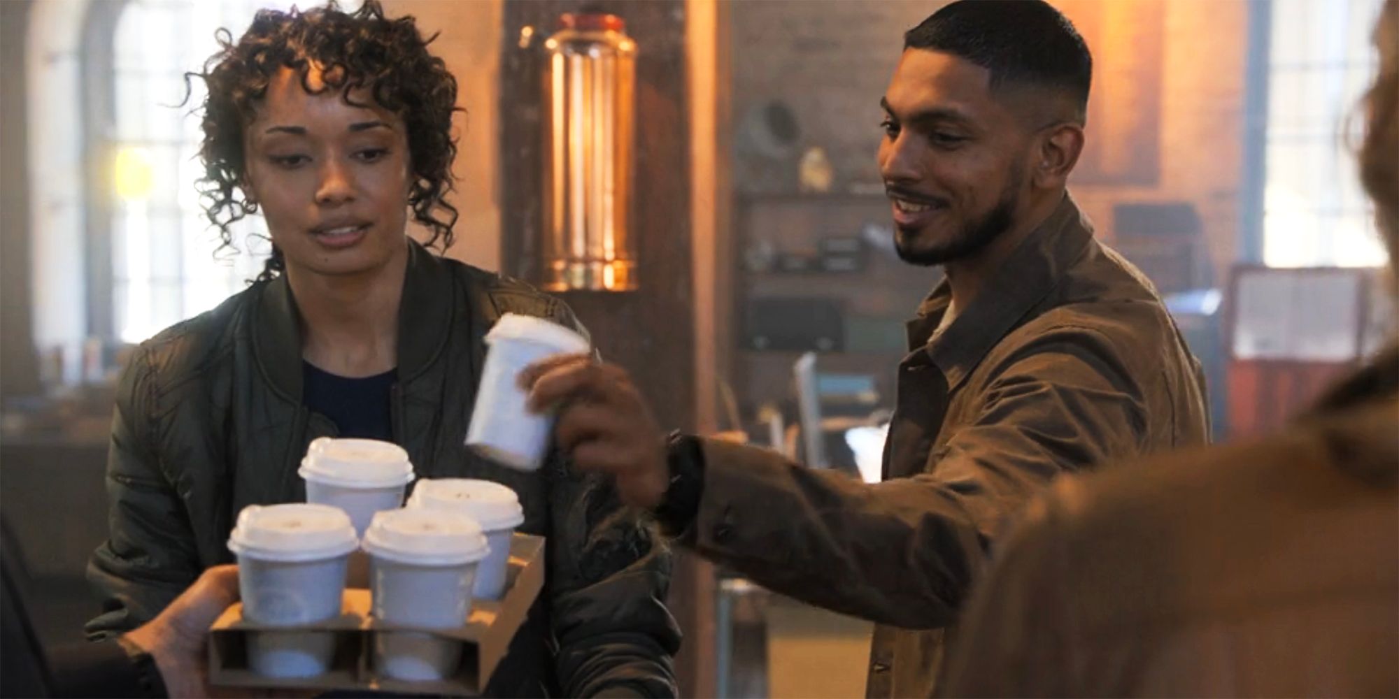 Mackey with coffees in NCIS Sydney