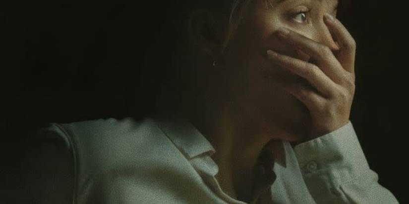 Maika Monroe as Agent Lee Harker with her hand over her mouth in Longlegs