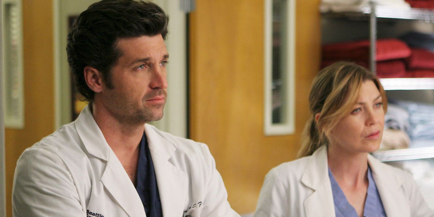 Meredith and Derek standing in the hospital in Grey's Anatomy