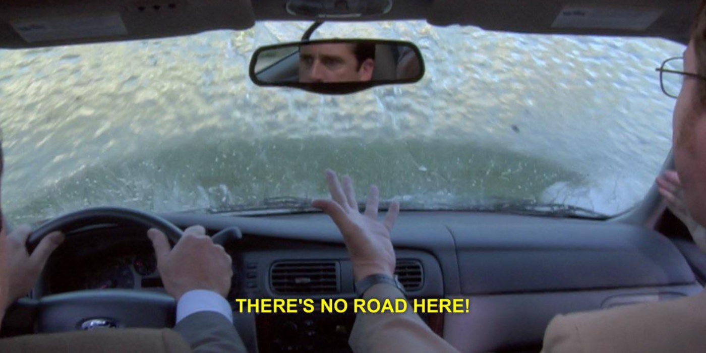 Michael Scott and Dwight falling with car in a lake in The Office